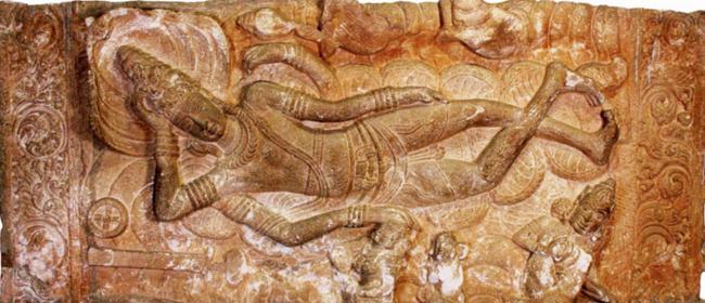sculpture of Vishnu asleep on Sesha (serpent deity) at one of the Early Chalukya temples