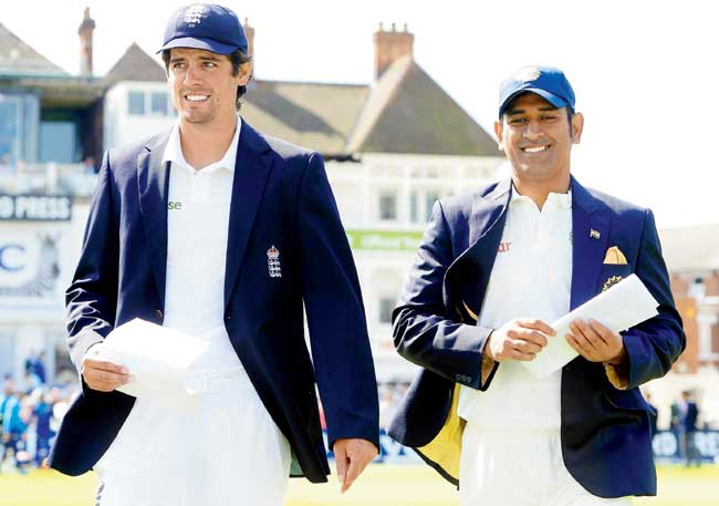 England captain Alastair Cook (left) and his Indian counterpart MS Dhoni walk out to toss at Nottingham recently. Pic/Getty Images