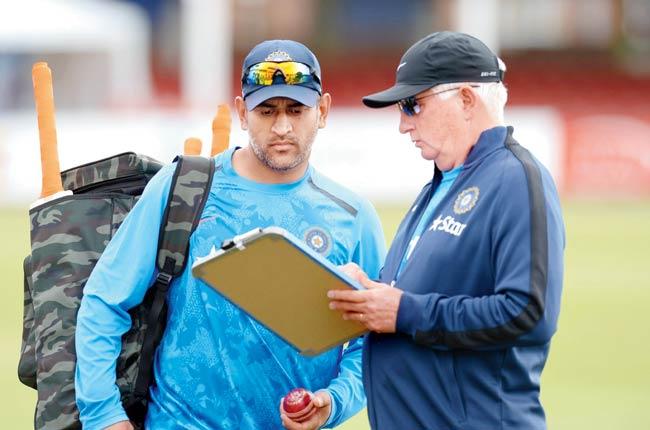 Skipper MS Dhoni (left) and coach Duncan Fletcher will have their task cut out in the five-Test series. Pic/Getty Images