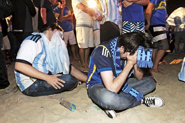Argentina fans react in dejection after the final between Argentina and Germany. Germany won 1-0