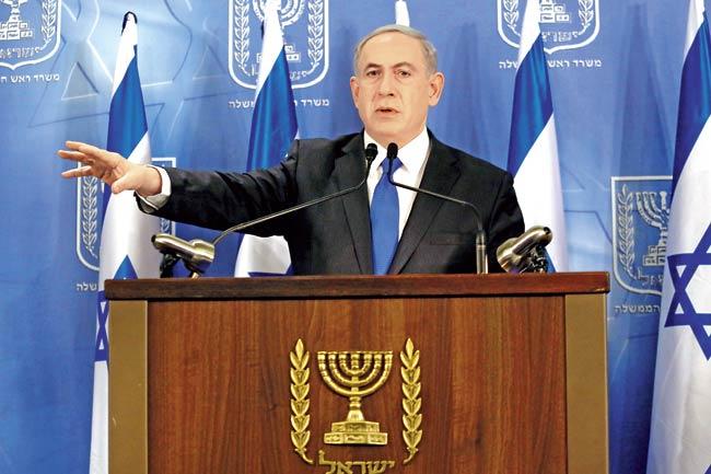 Israeli Prime Minister Benjamin Netanyahu speaks during a press conference at the defence ministry in the Israeli coastal city of Tel Aviv on July 11. Netanyahu said that he would not bow to world entreaties to stop a ferocious military campaign against rocket fire from the Gaza Strip. pic/AFP