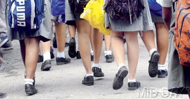 Parents say that school shoes take forever to dry, and changing into new socks every time their children venture outside the school building is not feasible. Pic/Nimesh Dave