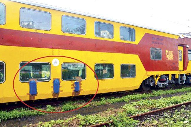 The bright yellow coaches have blue plastic foil all over them as well as tape on the windows. Pics/Shrikant Khuperkar