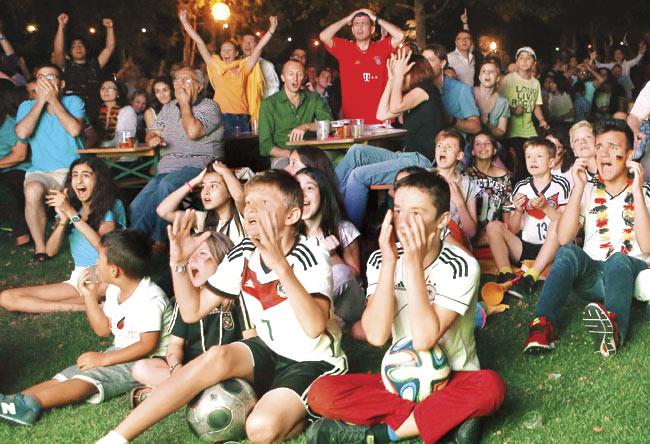 German fans put on their nation’s football kit