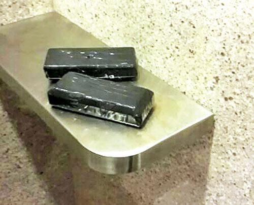 The ten gold bars, weighing 4.7 kg, were wrapped in black tape and kept in the washroom