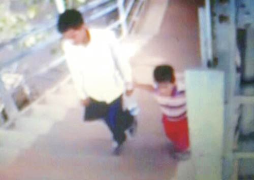 CCTV footage showing Chauhan walking off with the child