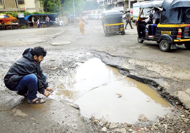 Our reporter measures a mammoth pothole and finds out it is 3x3 metres in area, and about 10 inches deep. Pics/Suresh KK