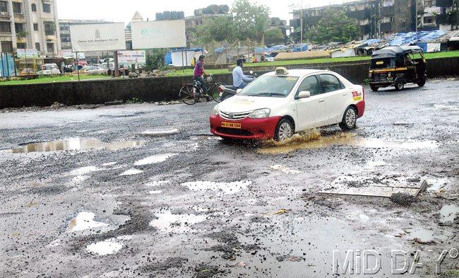 While potholes had been repaired on the road, heavy rains on the weekend caused them to reappear. Pic/Sayed Sameer Abedi