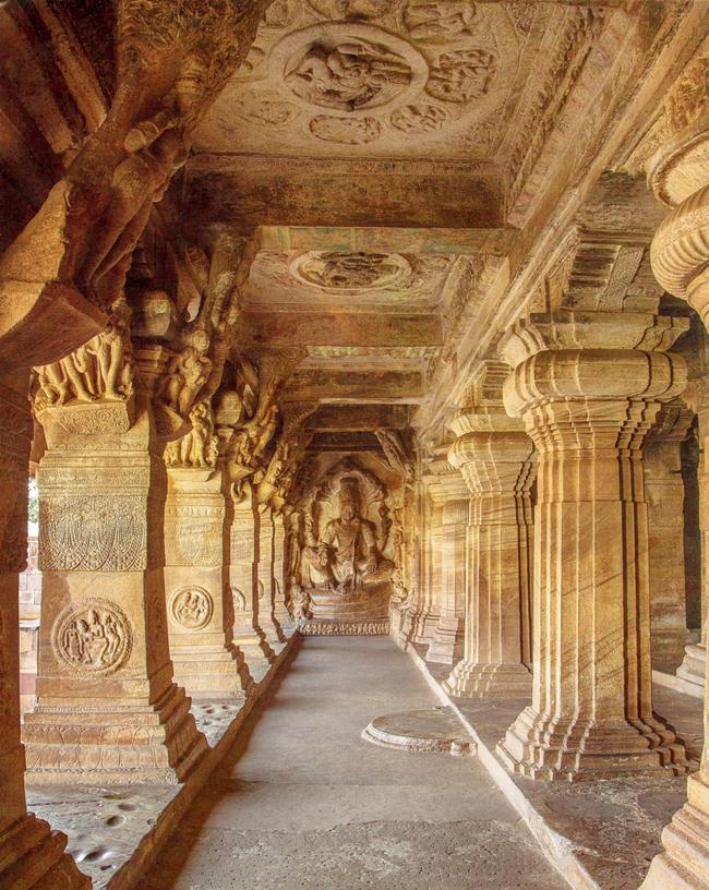 The cave temples in Badami and Aihole, built by the Early Chalukyas, are epitomes of rock-cut architecture in this part of the Deccan. This one is a columned aisle in Cave 3 above Badami, the largest cave temple of the Early Chalukyas. 