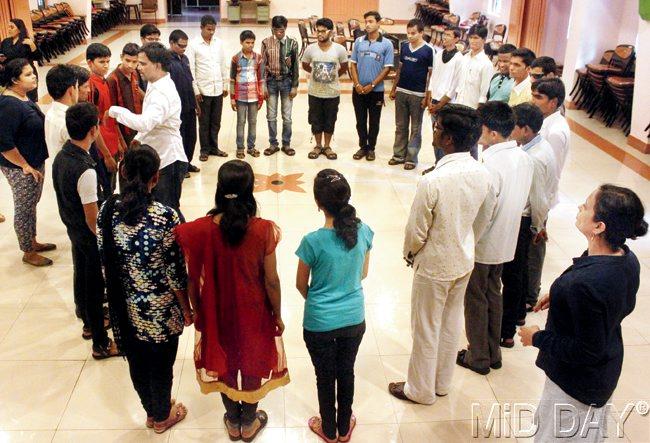 CIRCLE OF LIFE:  The participants form a circle as they await instructions, from Vivek Yadav (l) in white shirt 