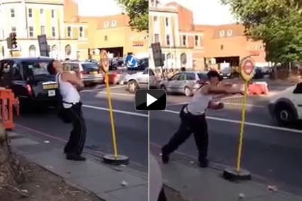 Hilarious video: Drunk man fights a bus stop