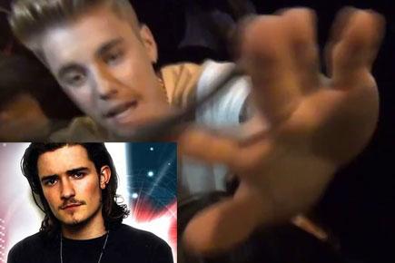 Orlando Bloom punches Justin Bieber. Here's why...