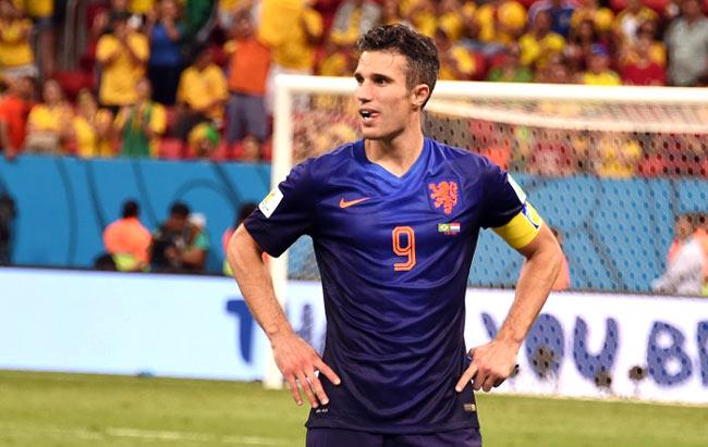 Netherlands- forward and captain Robin van Persie celebrates at the end of the third place play-off football match between Brazil and Netherlands during the 2014 FIFA World Cup at the National Stadium in Brasilia on July 12, 2014. Netherlands won 3-0. AFP PHOTO