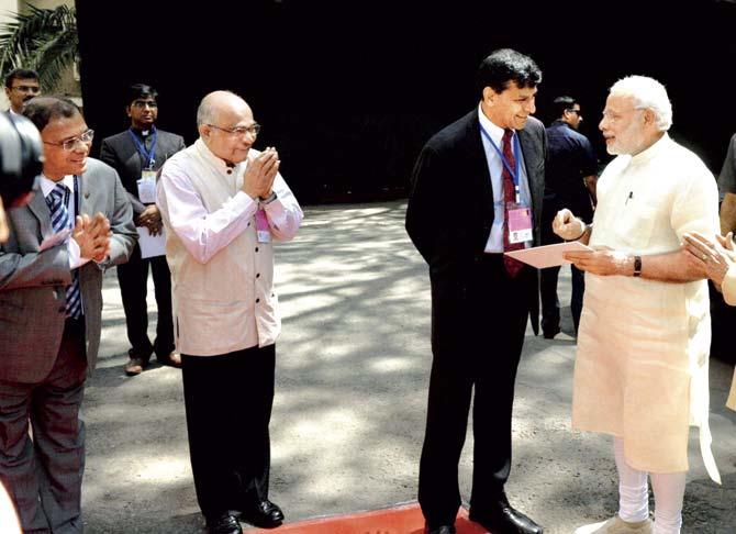 Prime Minister Narendra Modi being received by the Governor of Reserve Bank of India Raghuram Rajan for the financial inclusion conference to mark the 80th anniversary of RBI in Mumbai, last Thursday. Pic/PTI