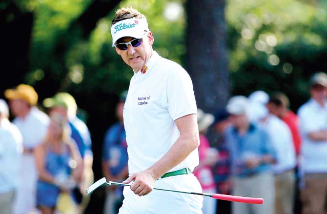 Ian Poulter walks to the first green during Round 1 of the 2015 Masters Tournament at Augusta National Golf Club yesterday. Pics/AFP