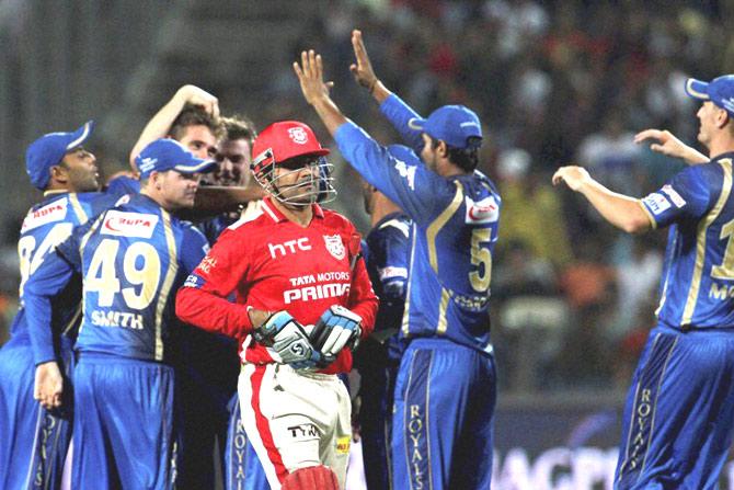 Kings XI Punjab player Virender Sehwag walks back to the pavilion during the IPL 2015 aganist Rajasthan Royals in Pune on Friday. PTI 
