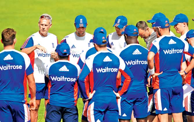 Coach Peter Moores (left) addresses England players during a training session at Sir Vivian Richards Stadium in Antigua on Saturday. Pic/Getty Images