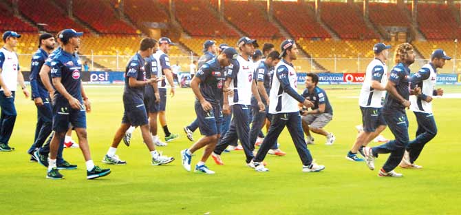 Mumbai Indians players warm-up during a practice session at the Sardar Patel Stadium in Motera, Ahmedabad yesterday. Pic/Nirav Trivedi