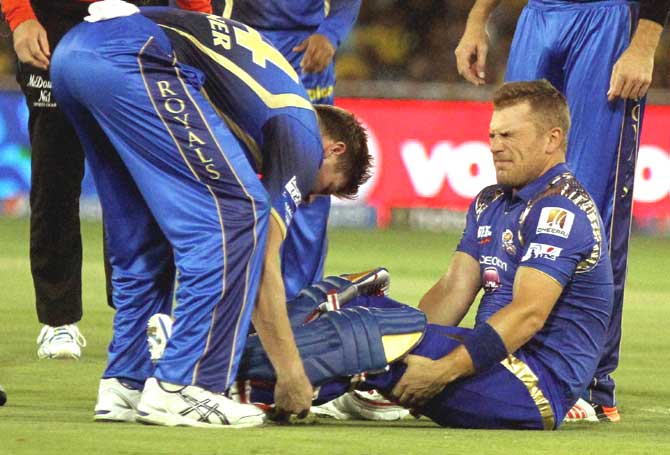 Ahmedabad: Mumbai Indians player Aaron Finch reacts after being hit by a ball during their IPL 2015 between Rajasthan Royals and Mumbai Indians at the Sardar Patel Stadium in Ahmedabad. Pic/PTI