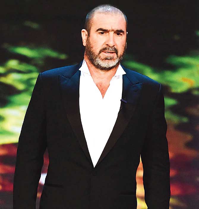 Former Manchester United footballer Eric Cantona amkes an appearance on the stage