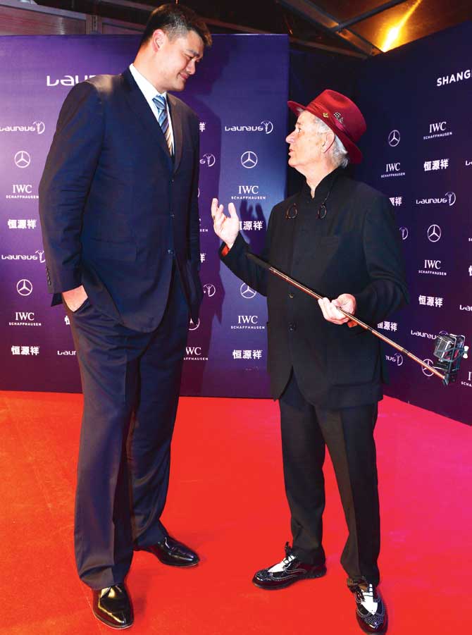 Ex-NBA star Yao Ming talks to Hollywood actor Bill Murray yesterday