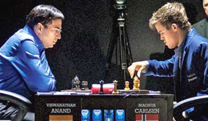 Viswanathan Anand and Magnus Carlsen. Pic: AP/PTI