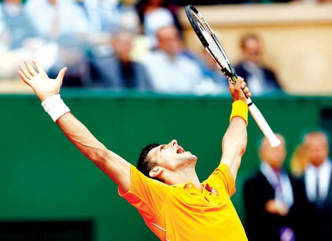 An elated Novak Djokovic celebrates after defeating Rafael Nadal in the semi-final. Pics/Getty Images