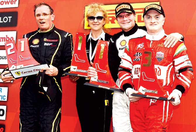Gautam Singhania (right) on the podium after finishing third in the first race of the Ferrari Challenge Europe Championship 2015 at the Monza circuit in Italy over the weekend