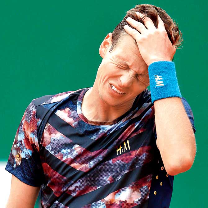 Berdych shows his dejection after dropping a point Pics/Getty Images