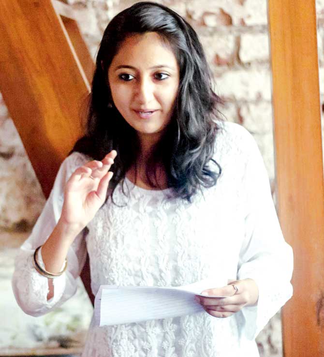 A participant at a poetry slam hosted by Airplane Poetry Movement at Birdsong Cafe, Bandra