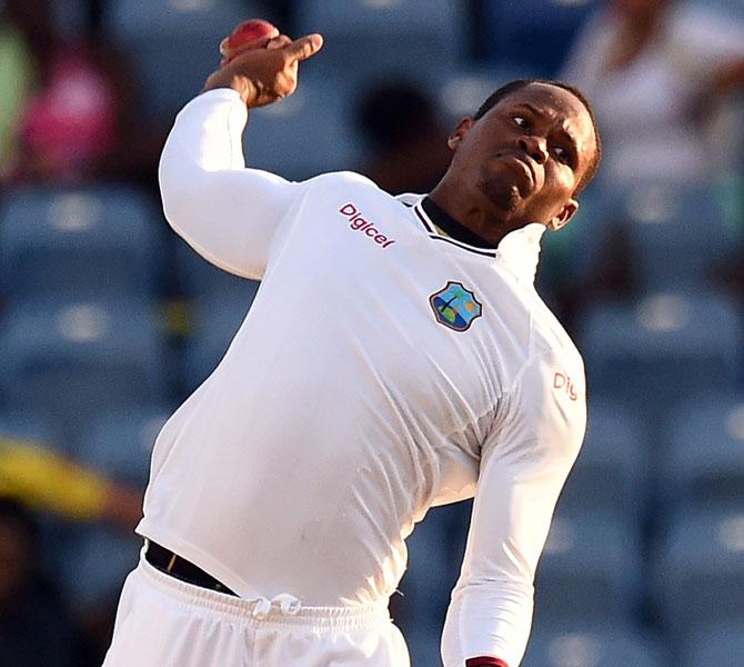 West Indies cricketer Marlon Samuels delivers a ball during day two of the second Test cricket match between the West Indies and England at the Grenada National Stadium. Pic/AFP  