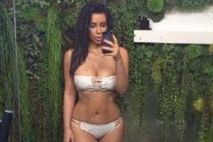 Kim Kardashian flaunts her slim and toned figure in a revealing image