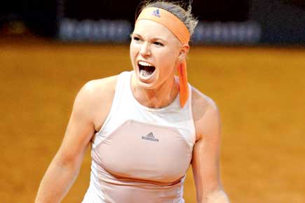 Caroline Wozniacki wins marathon against Simona Halep 
