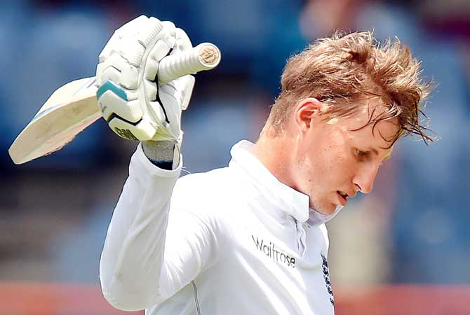 Joe Root leaves the field on Friday. Pic/AFP