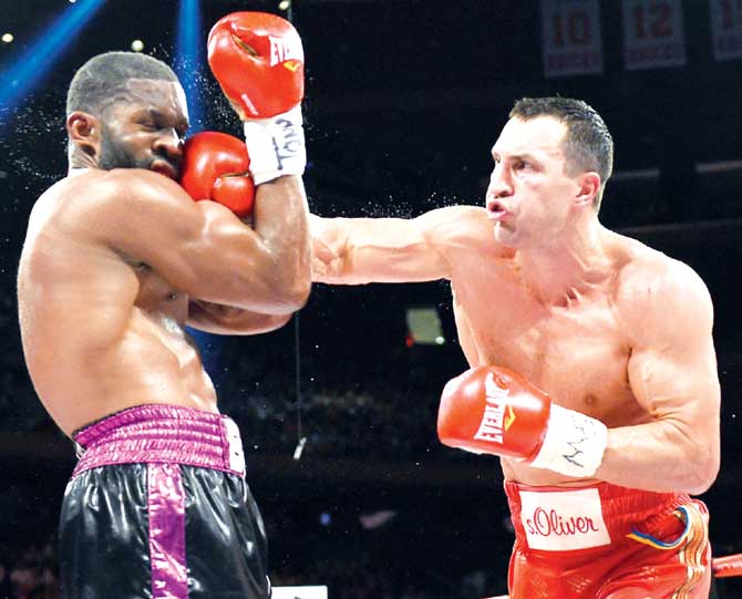 Wladimir Klitschko (right) lands a right hook on Bryant Jennings  during their World Heavyweight Championship bout in New York