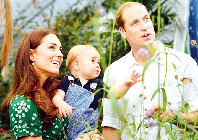 Prince William (left) and Catherine, Duchess of Cambridge (extreme left) with Prince George during a visit to the Sensational Butterflies exhibition at the Natural History Museum in London, last July. Pic/AFP