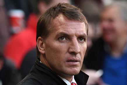 Football: Liverpool manager Rodgers clings to top four hopes despite Hull defeat