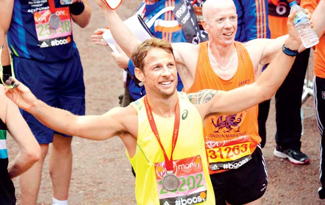 Jenson Button at the finish line of the London Marathon on Sunday