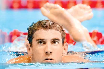 Olympic champ Michael Phelps to stick with coach Bowman