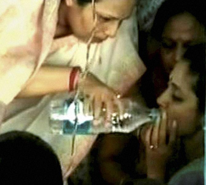 NCP MP Supriya Sule is ffered water after she fainted at an election rally in Sangli on Tuesday. Pic/PTI