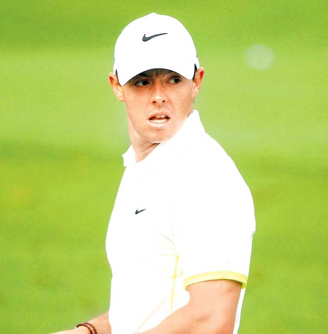Rory McIlroy looks on from the practice range during a practice round prior to the start of the 2015 Masters Tournament at Augusta National Golf Club. Pic/AFP