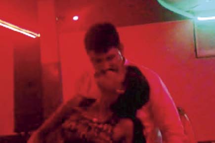 On-duty Thane police constables caught on camera kissing bar girls