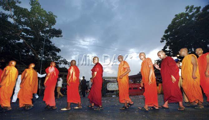 Buddhist monks in a procession during B R Ambedkar’s 124th birth anniversary at Chaitya Bhoomi, Dadar, on Tuesday. Pic/Atul Kamble