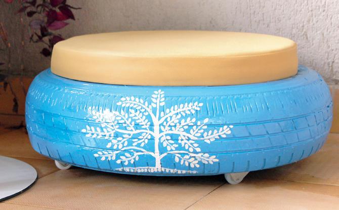 A handpainted pouf made from car tyre