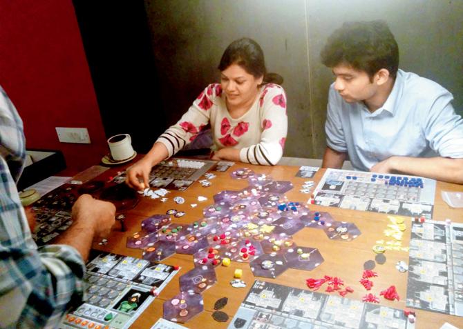 Members of Mumbai Board Gamers playing a game called Eclipse