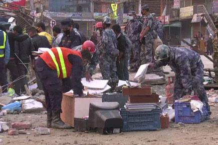Rescuers still at work in Kathmandu at sunset