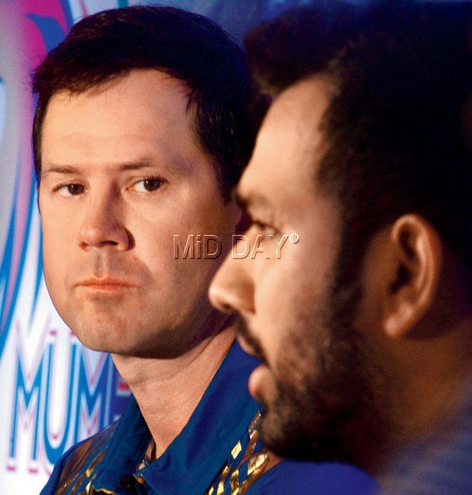 MI coach Ricky Ponting (left) listens to skipper Rohit Sharma during the media interaction yesterday.
