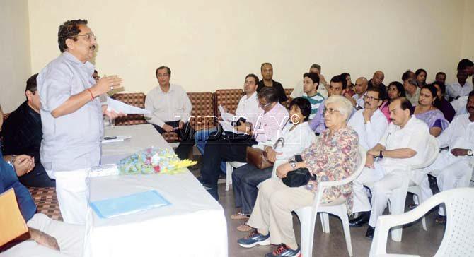 MLA Raj Purohit (l) talks to Colaba residents at Radio Club