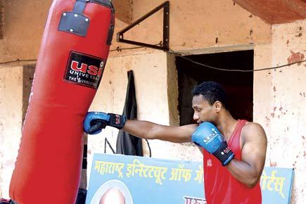 Pune-based National boxing champ drives tempo to make ends meet