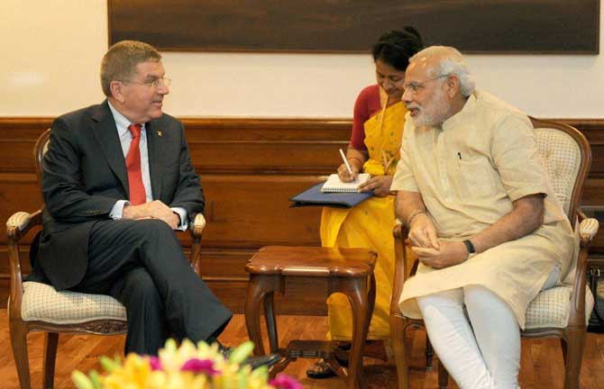 rime Minister Narendra Modi with President of the International Olympic Committee Thomas Bach during a meeting, in New Delhi on Monday. PTI